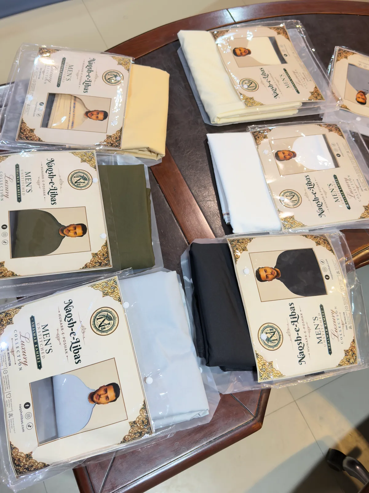 Packed suits with our Naqsh-e-Libas cards